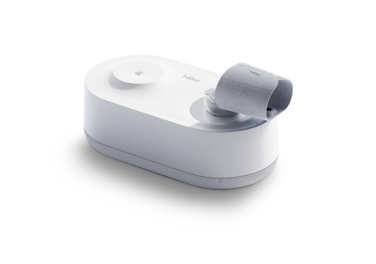 Close-up of Hälsa Baby temperature monitor designed for tracking infant wellness, featuring a sleek design and innovative technology for monitoring temperature and vital signs.
